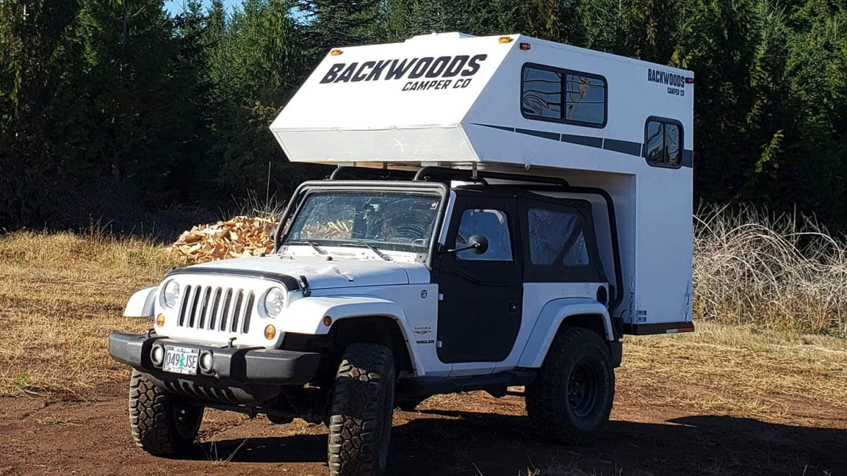 Hard wall camper hangs on Jeep Wrangler like a backpack with bathroom